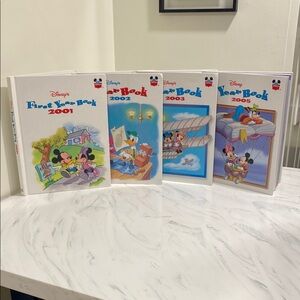 Vintage Disney Year Books from 2001, 2002, 2003 and 2005. Excellent condition